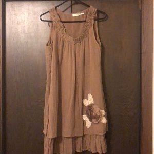 Brown airy and flowing type dress.